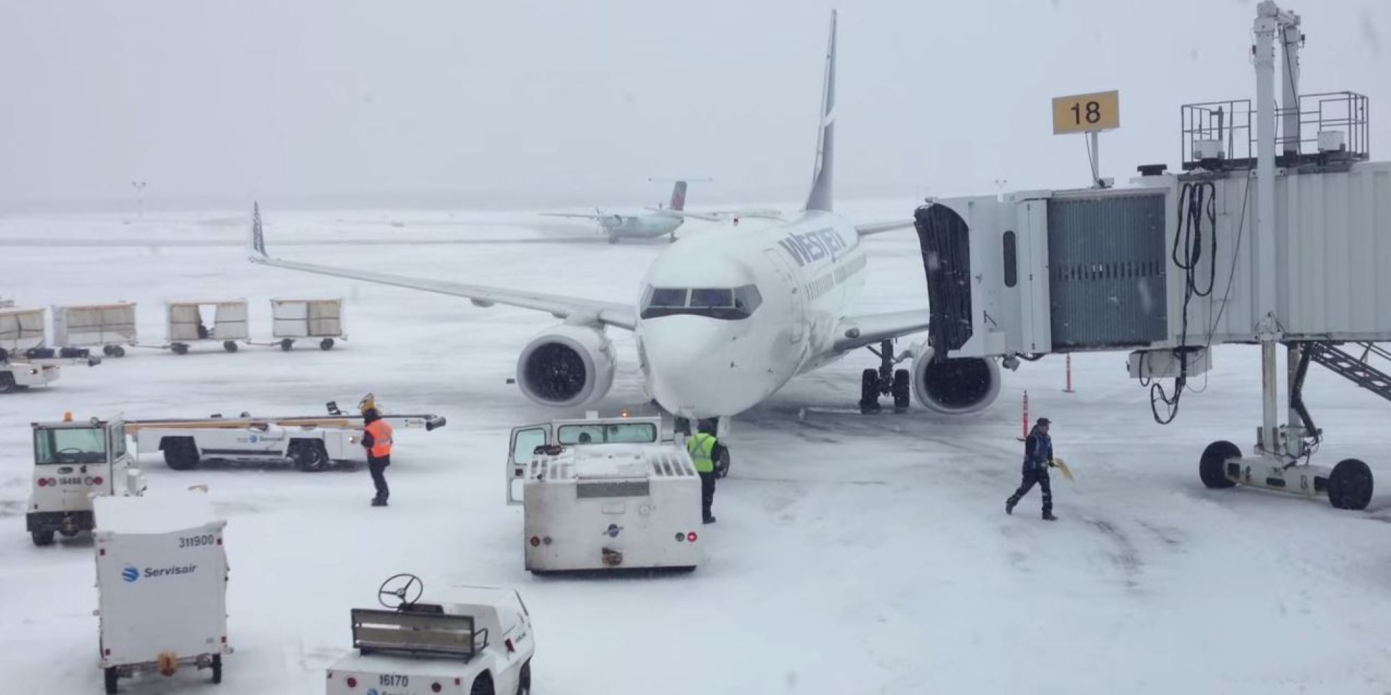 Heavy winds push Westjet Boeing 737 away from the gate at Halifax Airport